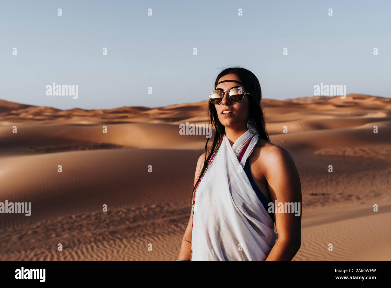 Beautiful young woman in the desert, Merzouga, Morocco Stock Photo