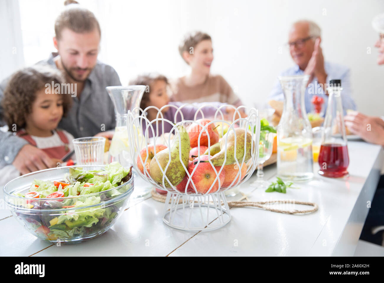 Extended family having healthy lunch at home Stock Photo