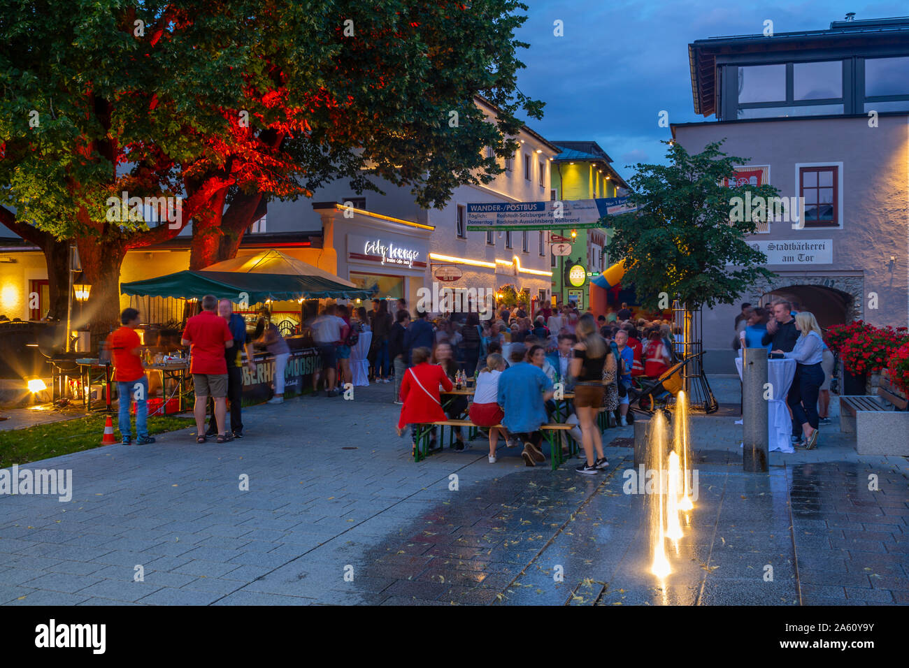 View of people enjoying nightlife in Radstadt, Styria, Austrian Tyrol, Austria, Europe Stock Photo
