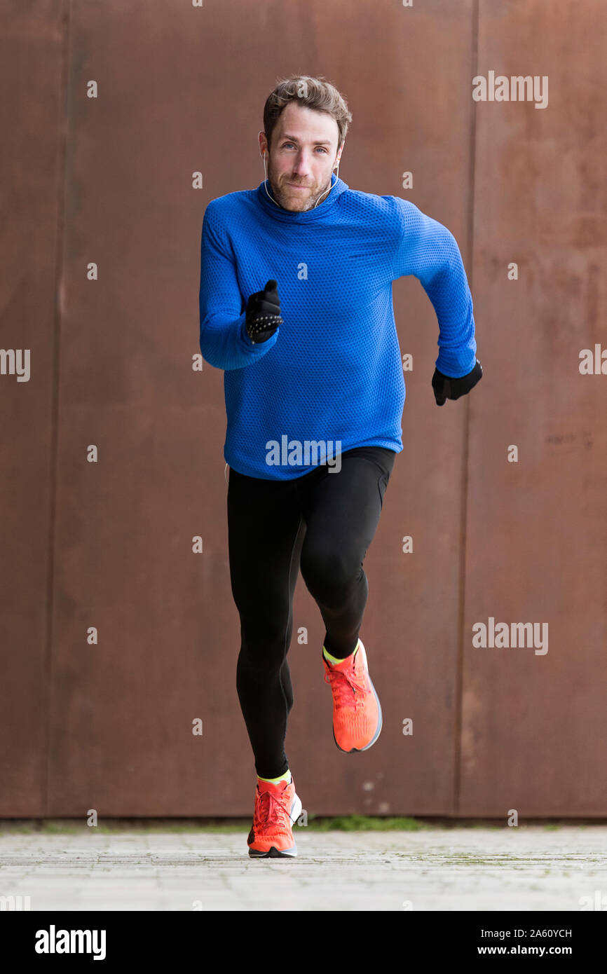 Jogger running on a street Stock Photo