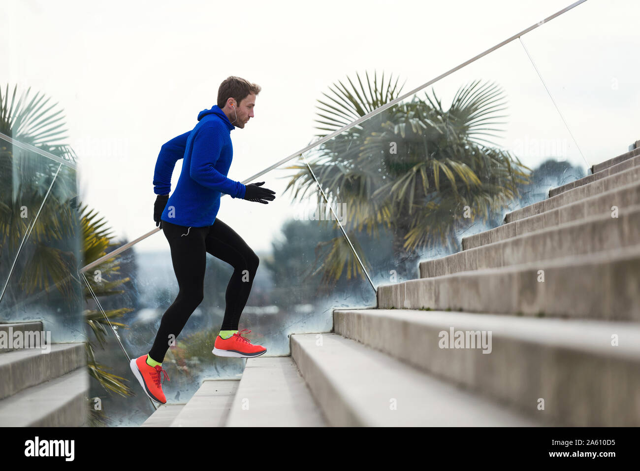 Jogger running on steps Stock Photo Alamy