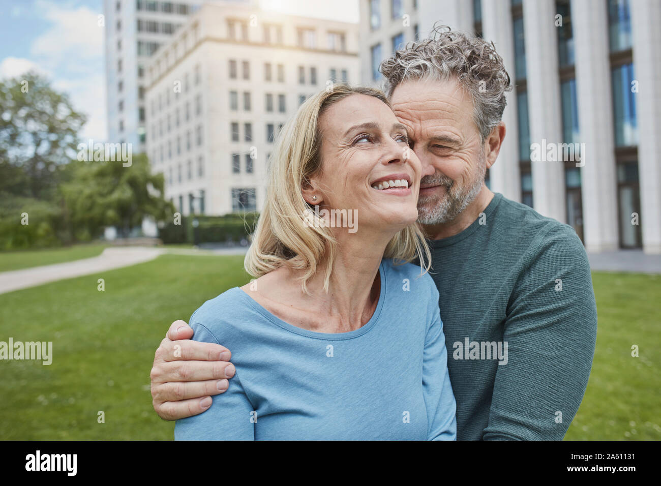 Happy mature couple hugging in the city Stock Photo