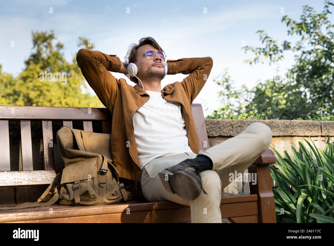 Man sitting bench behind hi-res stock photography and images - Alamy