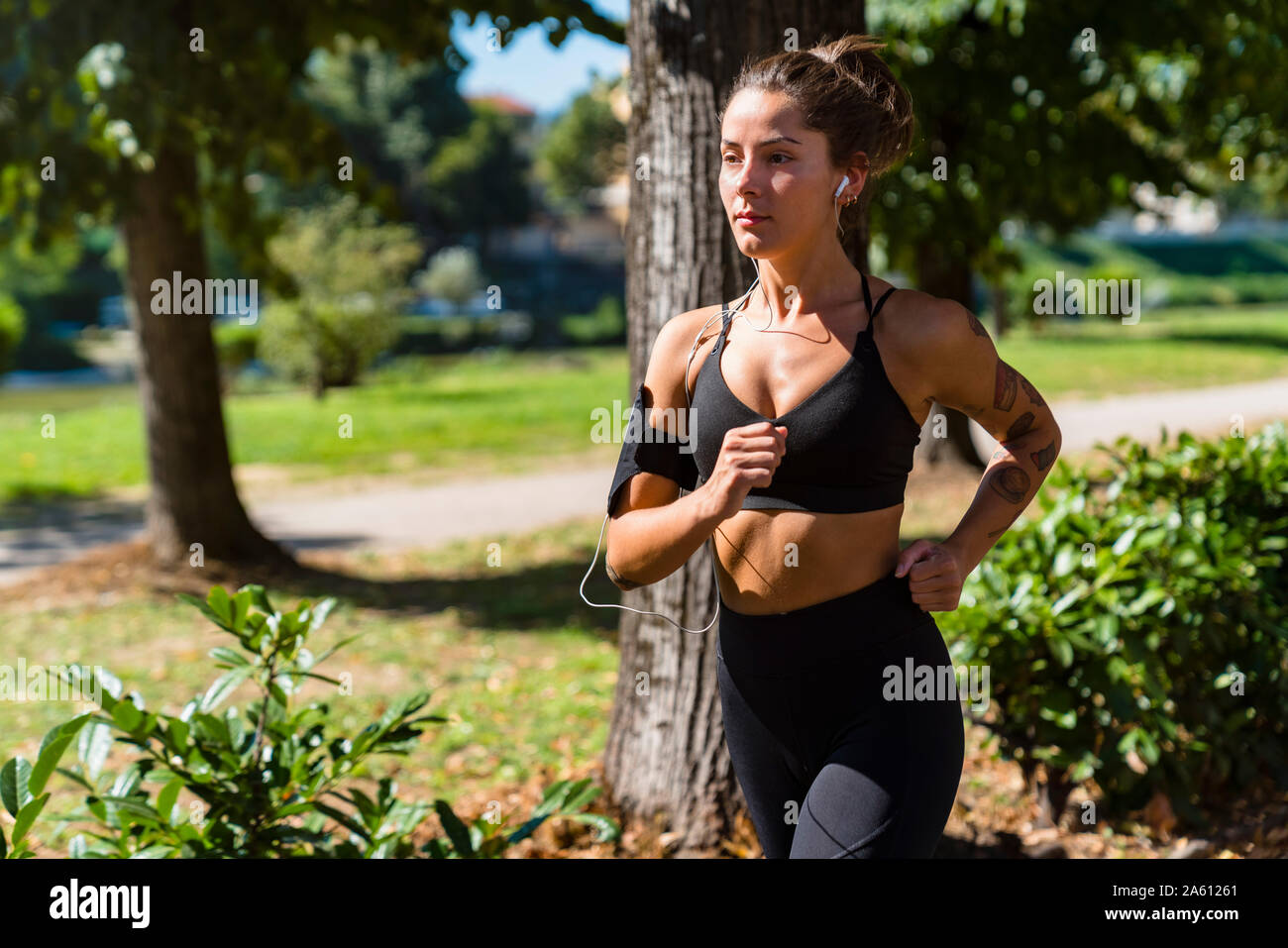 Young woman running in a park Stock Photo
