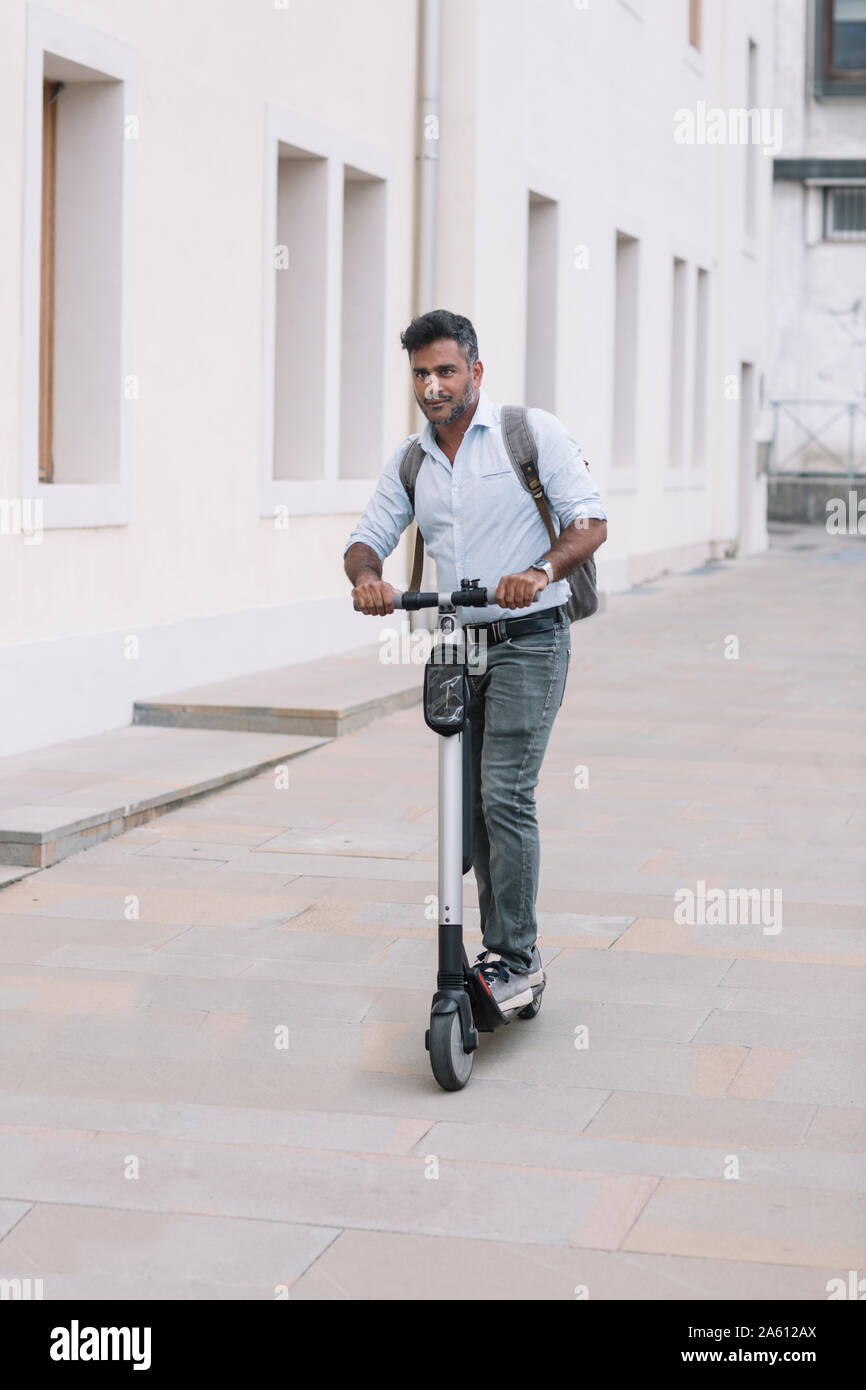 Indian man riding scooter hi-res stock photography and images - Alamy