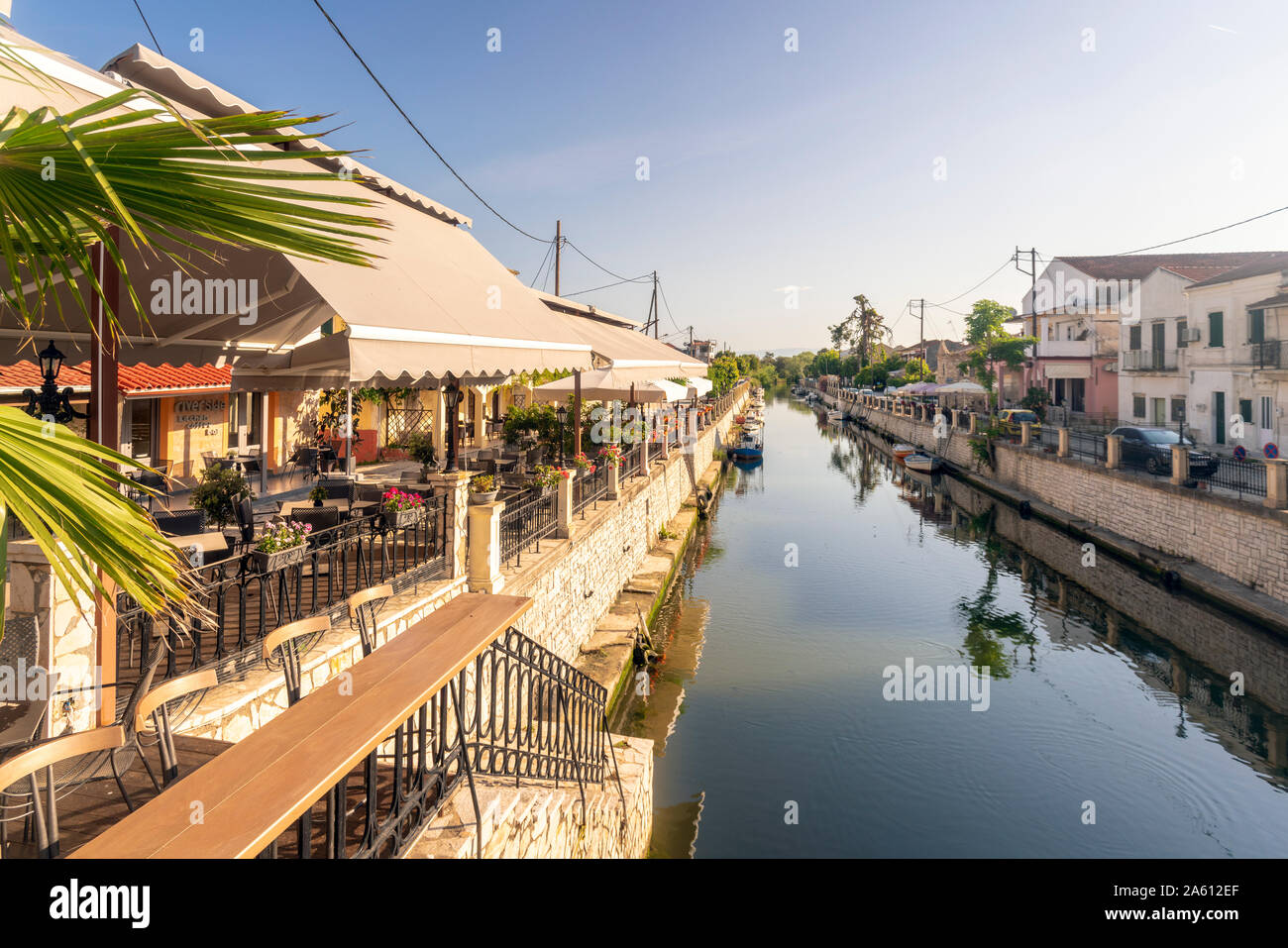 Canal amidst residential buildings against sky in Corfu, Greece Stock Photo