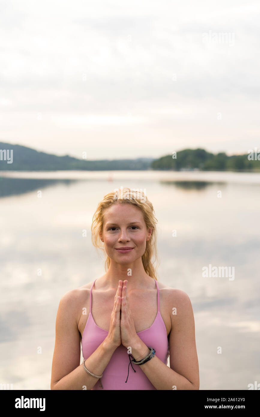 Portrait of smiling young woman at a lake Stock Photo
