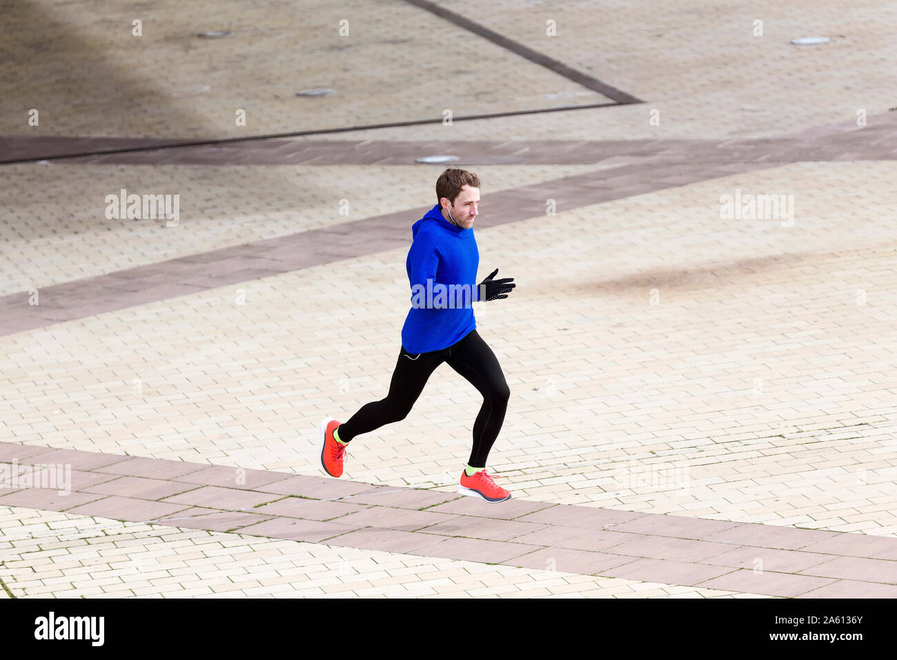 Jogger running on a street Stock Photo