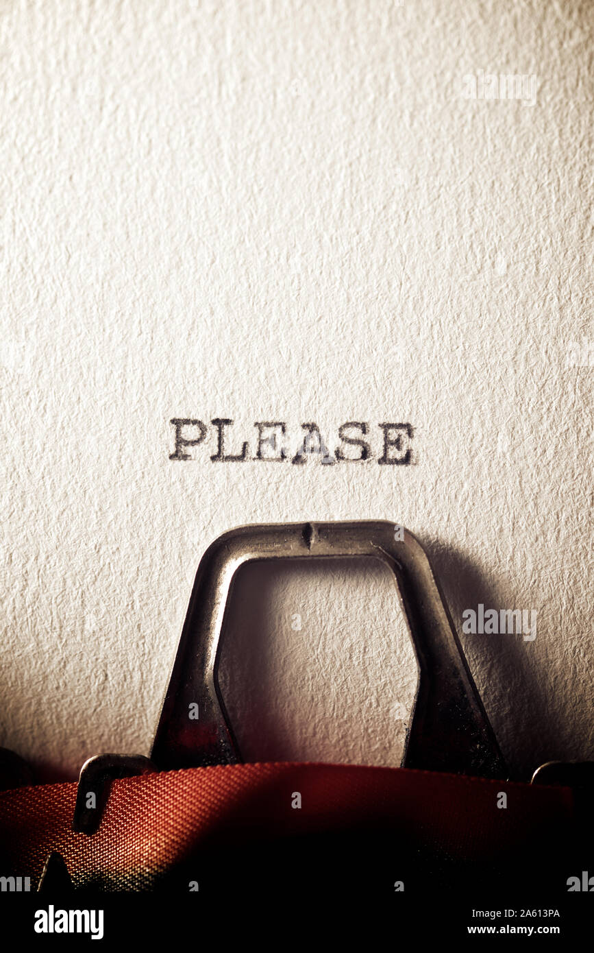 The word, Please, written with a typewriter. Stock Photo