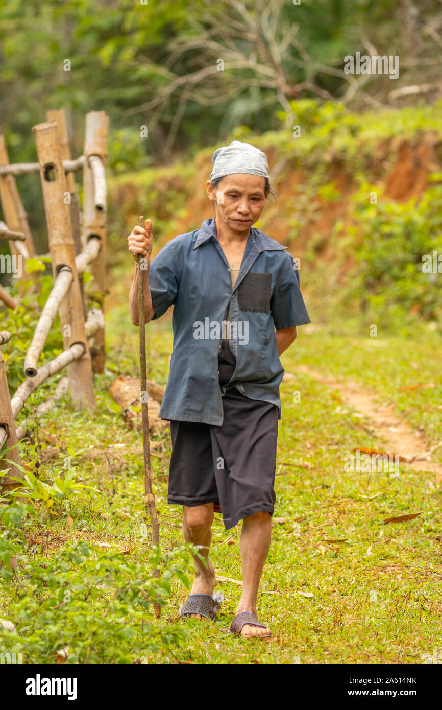 Pu Luong Nature Reserve, Thanh Hoa / Vietnam - March 10 2019: An old woman walking in the beautiful nature. Stock Photo