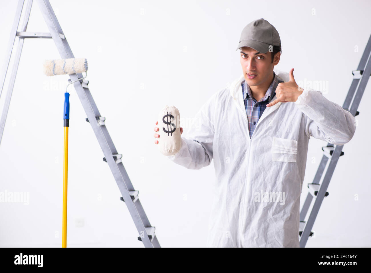 Painter working at the construction site Stock Photo - Alamy