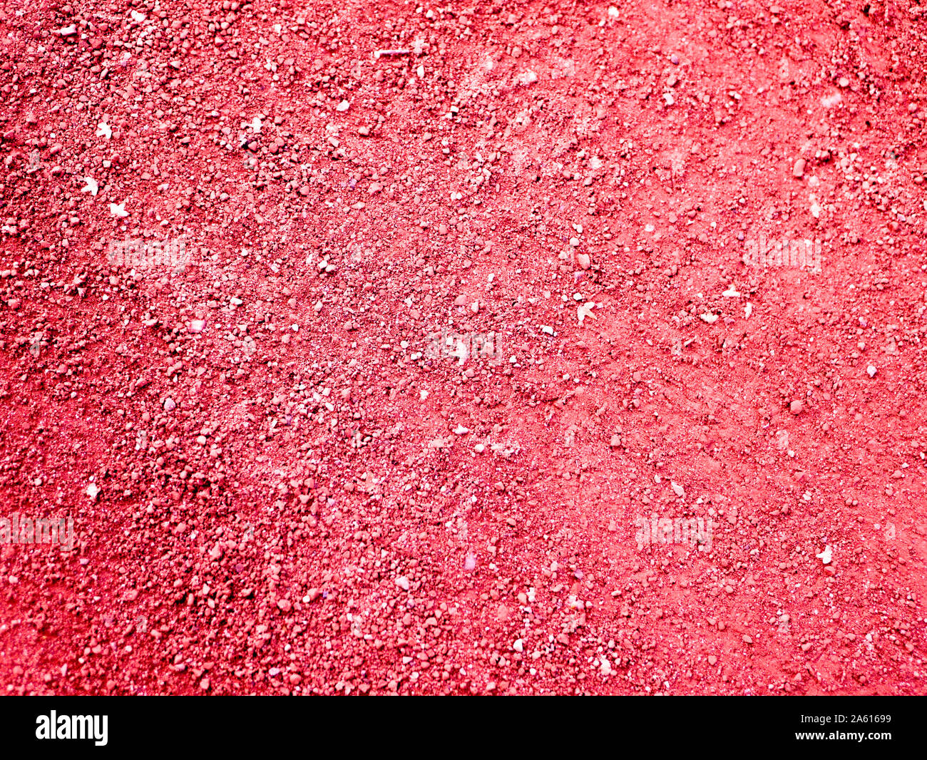 red sand close up. sand texture orange treadmill. Texture of dry red clay with stones Stock Photo