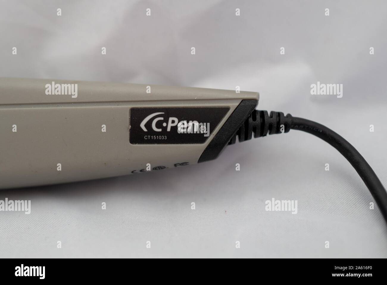 Close-up of logo and cable on C Pen text-reading USB pen, ca 2009, an early  example of OCR-based assistive technology from software company Anoto, on  white background, August 27, 2019 Stock Photo -
