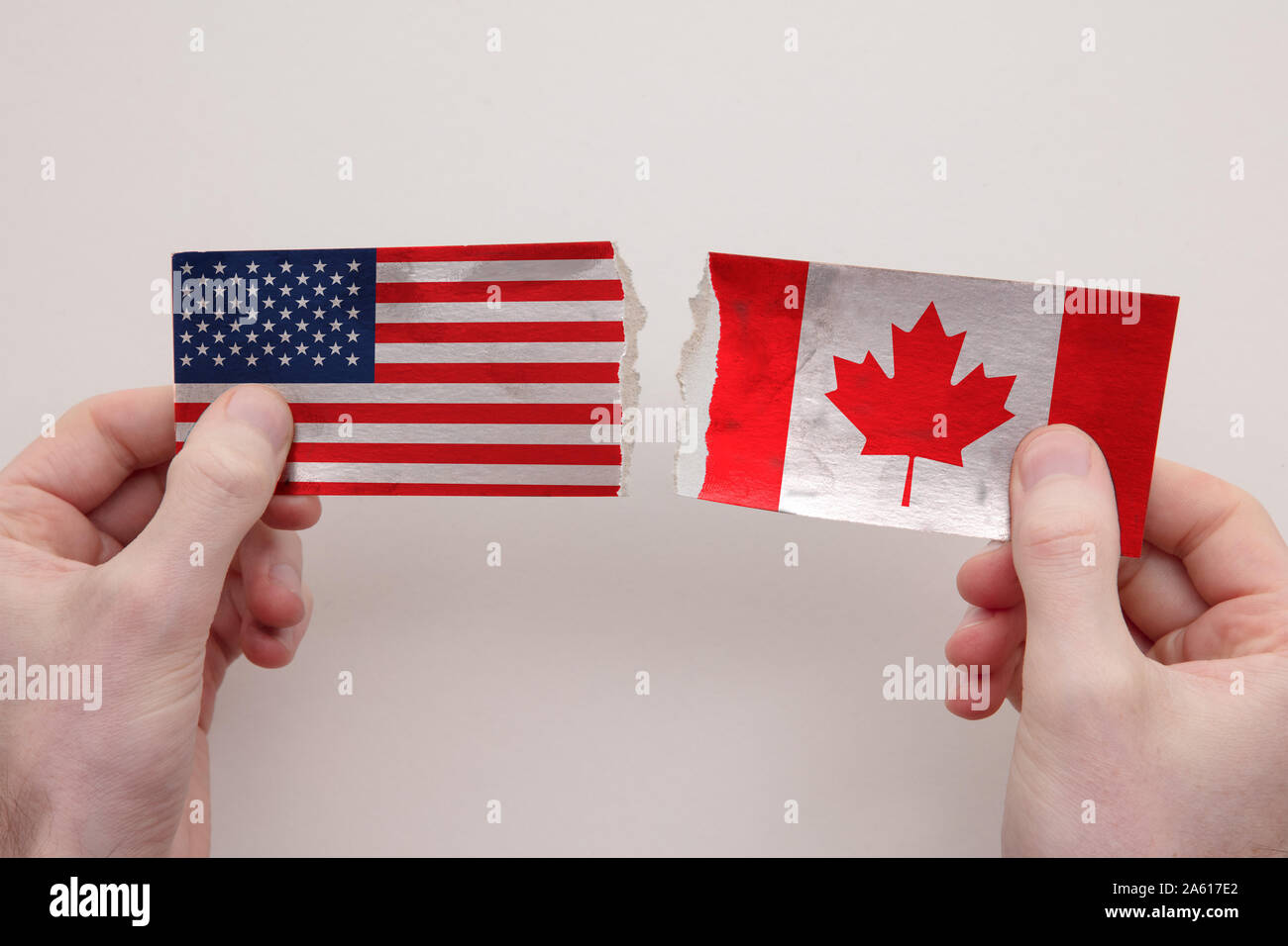 USA and Canada paper flags ripped apart. political relationship concept ...