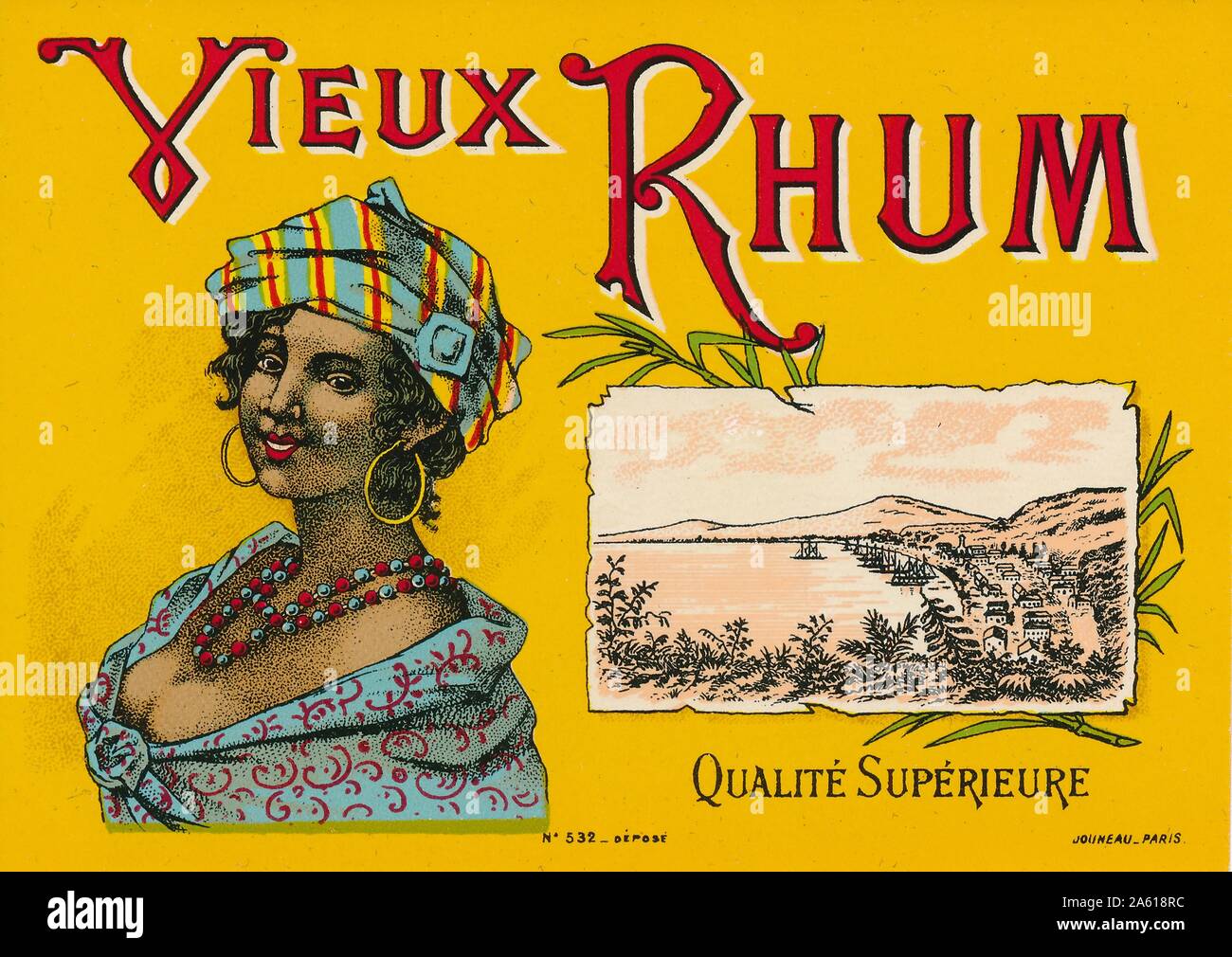 Label from a bottle of Martinique cane rum with the text 'Vieux Rhum, ' a profile bust illustration of a smiling, turbaned woman, and a landscape sketch of a Caribbean harbor, produced by Jouneau, Paris, France, 1935. () Stock Photo