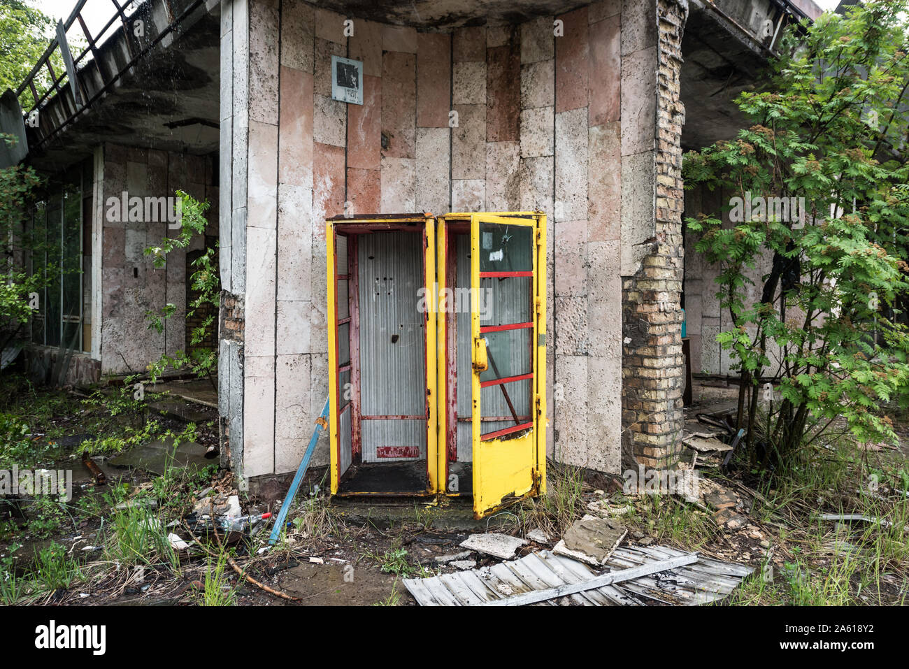 rusty yellow telephote booth in abandoned Pripyat, Chernobyl, Ukraine Stock Photo