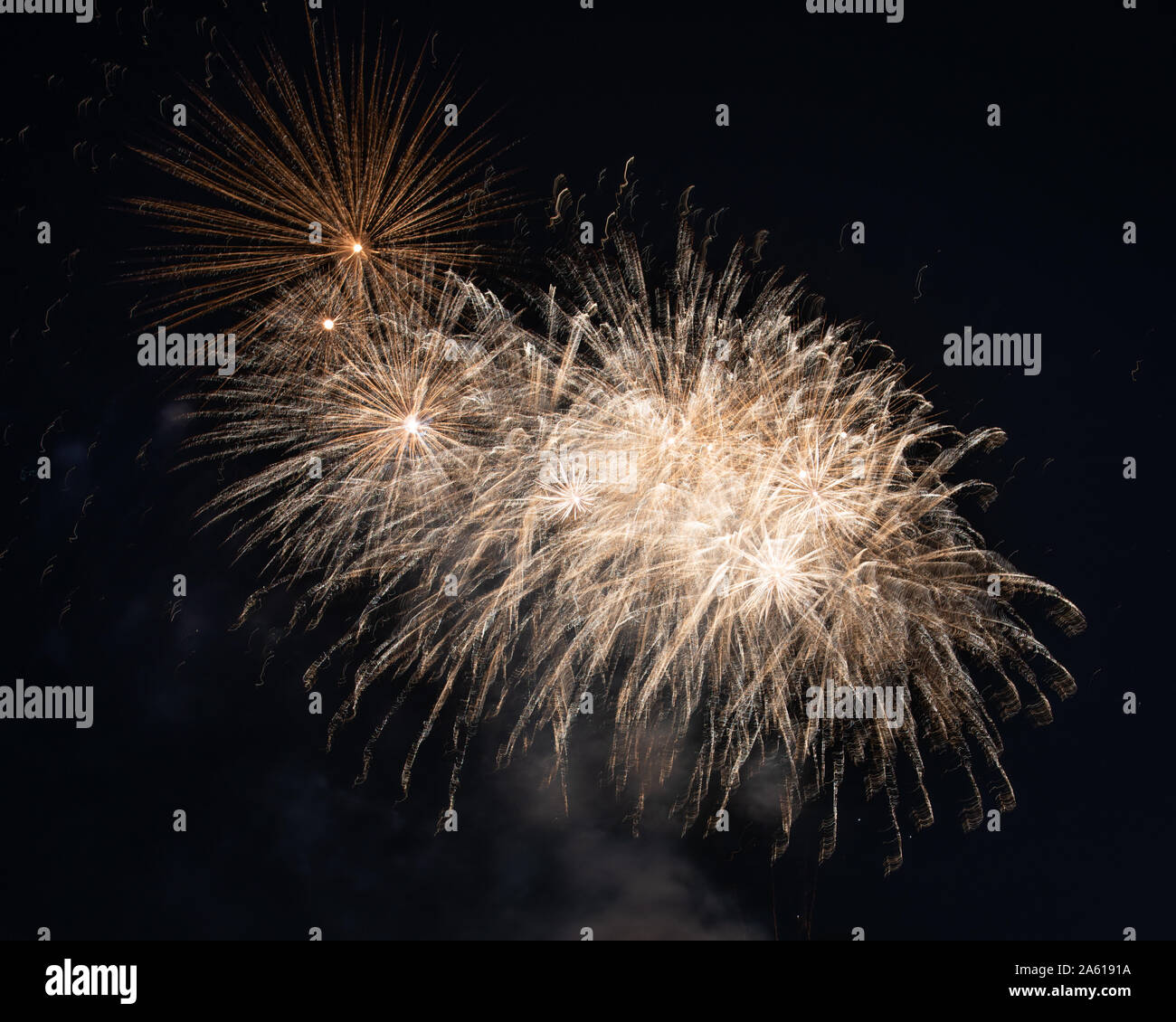Fireworks photographed in the night sky with a long exposure and black background high quality image good for pc backgrounds and fine art prints. Stock Photo