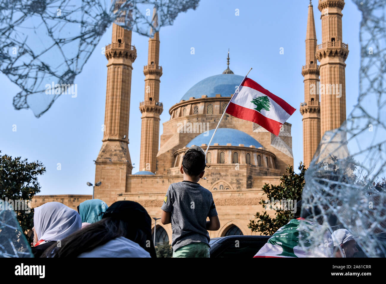 Protestors in Beirut Lebanon say they will not leave until the entire government has stepped down. Across the country similar mass gatherings have settled in for the long haul as the people come together for a 7th consecutive day. United under one flag, this multi-sect country is calling for an end to its sectarian government and retribution for the corruption it has been subject to for 30 years. Stock Photo