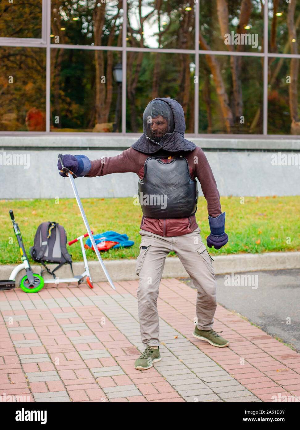 Two armed men lead a sword fight, a medieval fight, at a fun medieval