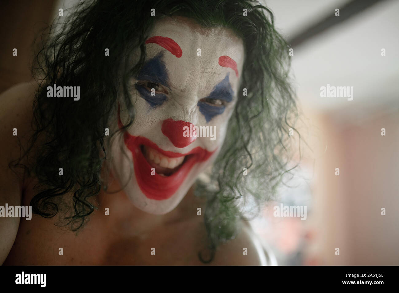 Dnipro, Ukraine - October 22, 2019: Portrait of the cosplayer in the image of a crazy clown Arthur Fleck from the psychological thriller 'Joker' in th Stock Photo