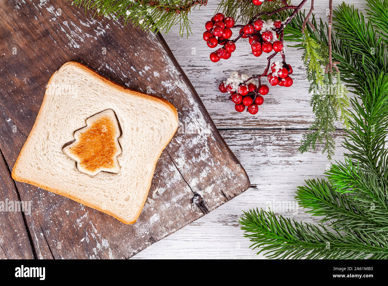 Toasted bread shaped like a fir tree on vintage rustic wooden cutting board  Stock Photo - Alamy