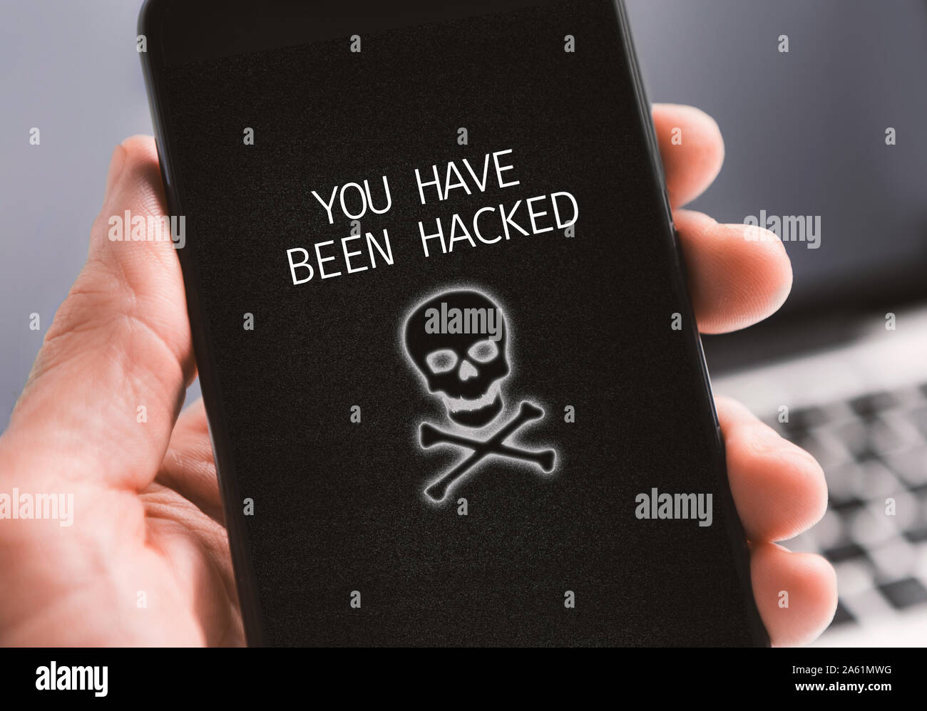 Modern smartphone with you have been hacked notification on screen Stock Photo