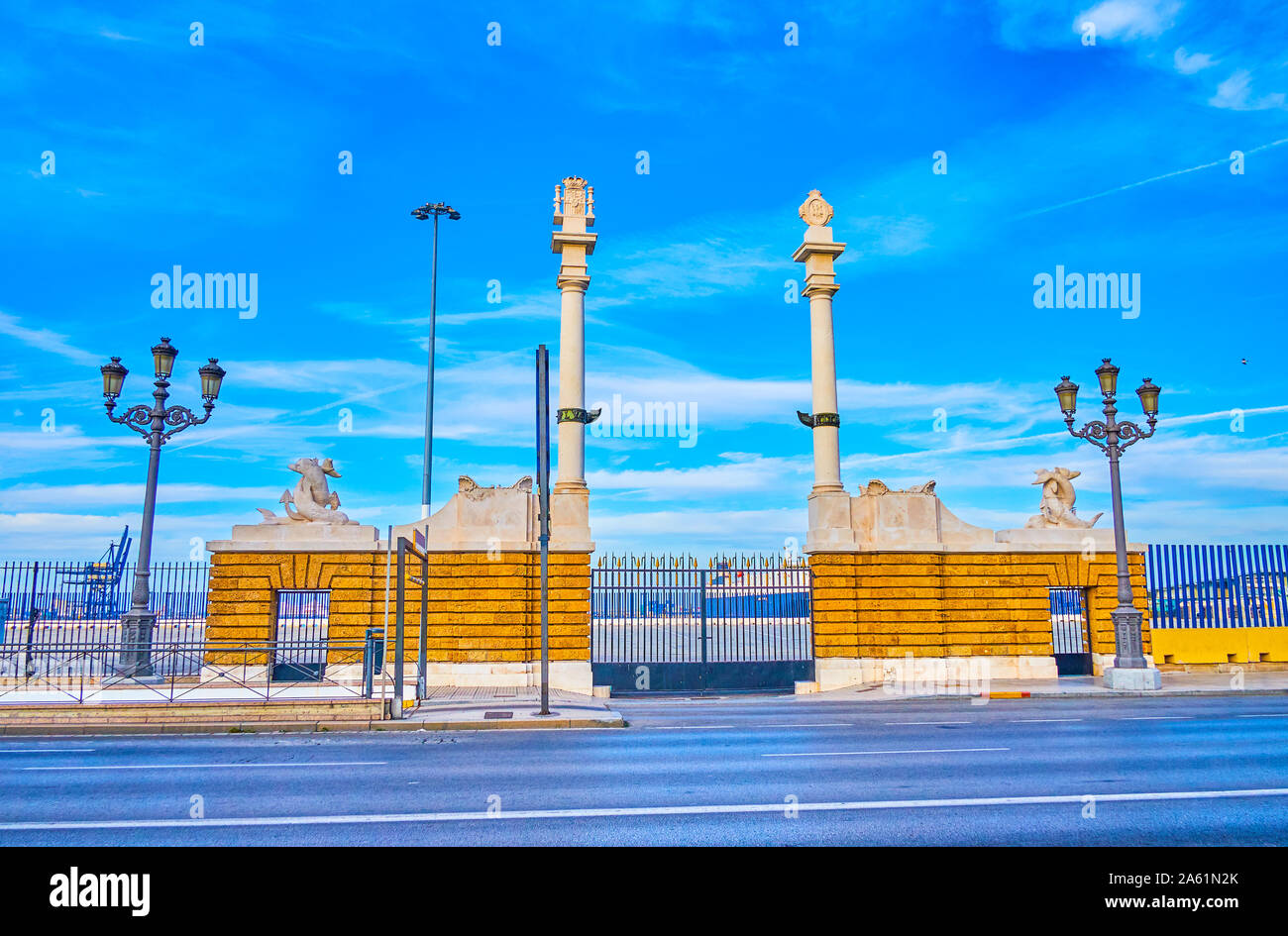 The old Puerta del Mar gate to the port with high white stone pillars