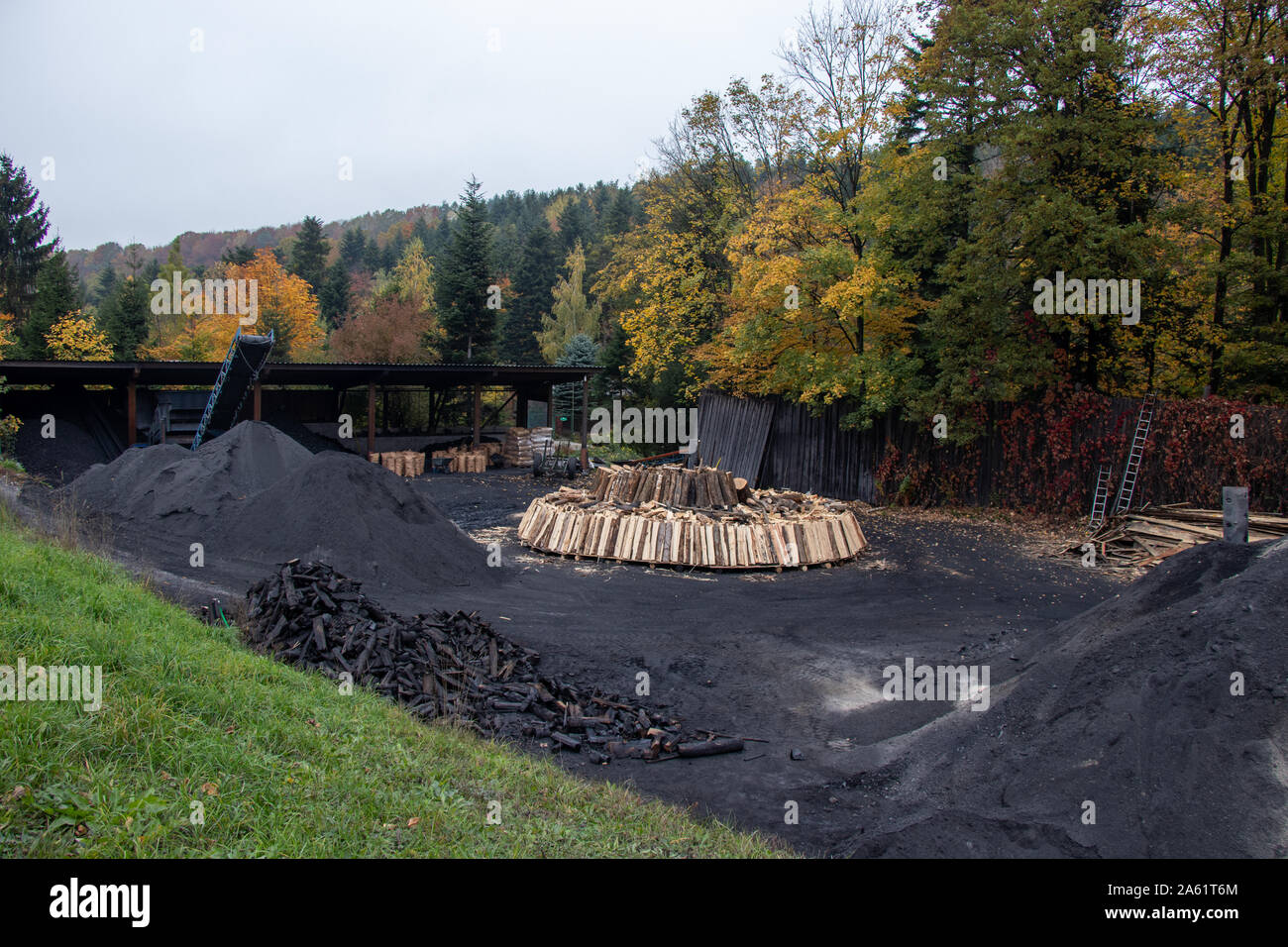Charcoal pile prepared for churning Stock Photo Alamy