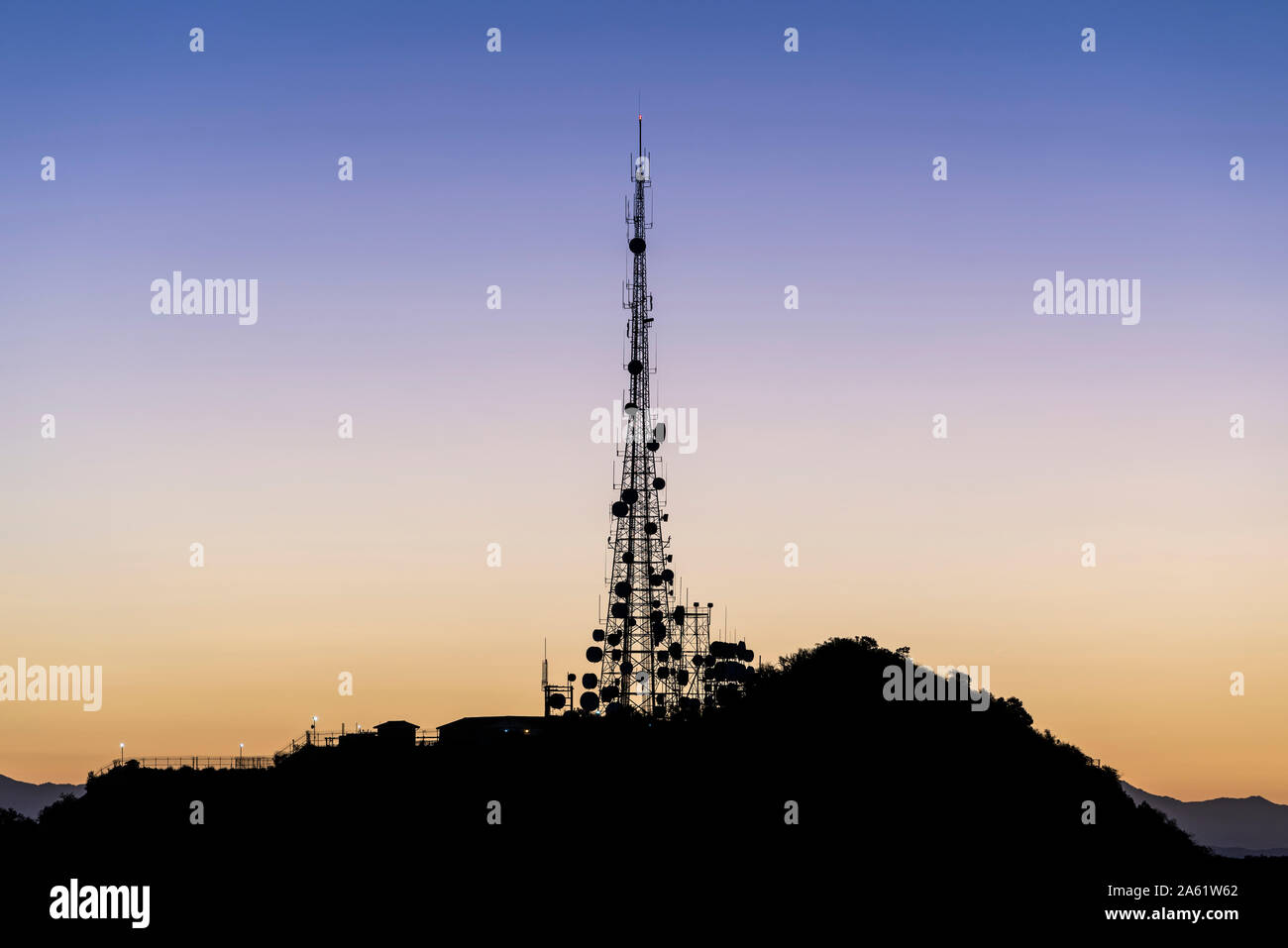 Dawn view of Griffith Park communication tower on Mt Lee above Hollywood in Los Angeles, California. Stock Photo
