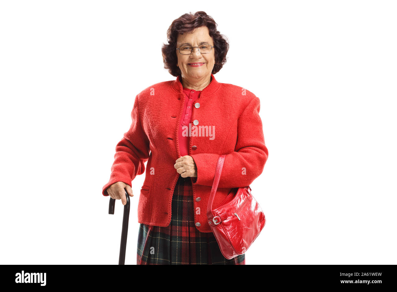 Elderly lady in a red coat with a walking cane isolated on white background Stock Photo