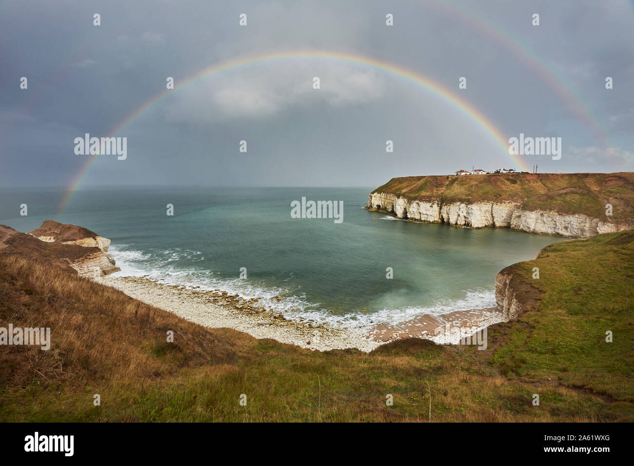 Rainbow (double) over Thornwick Bay, Flamborough Head, East Yorkshire, England, UK Stock Photo