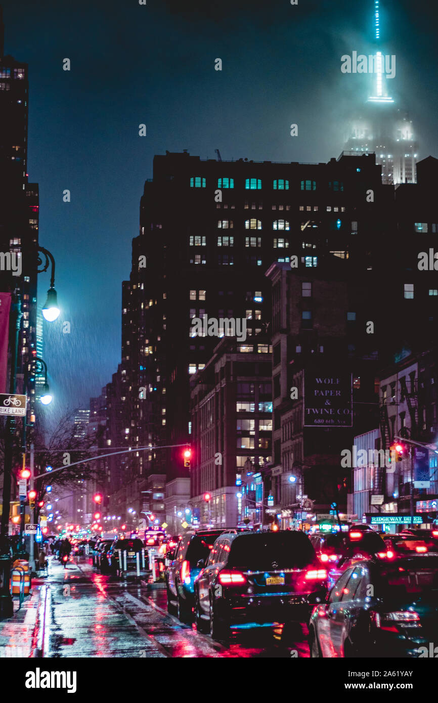 Rainy evening traffic near Empire State Building, New York. Stock Photo