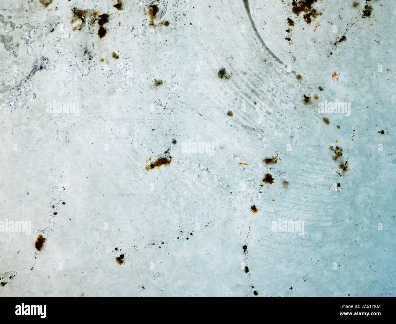 rust points on a blue background. blue wall texture deteriorated with rust points. Texture of painted grey metal with corrosion points. Stock Photo