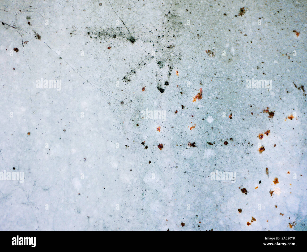 rust points on a blue background. blue wall texture deteriorated with rust points. Texture of painted grey metal with corrosion points.  Stock Photo