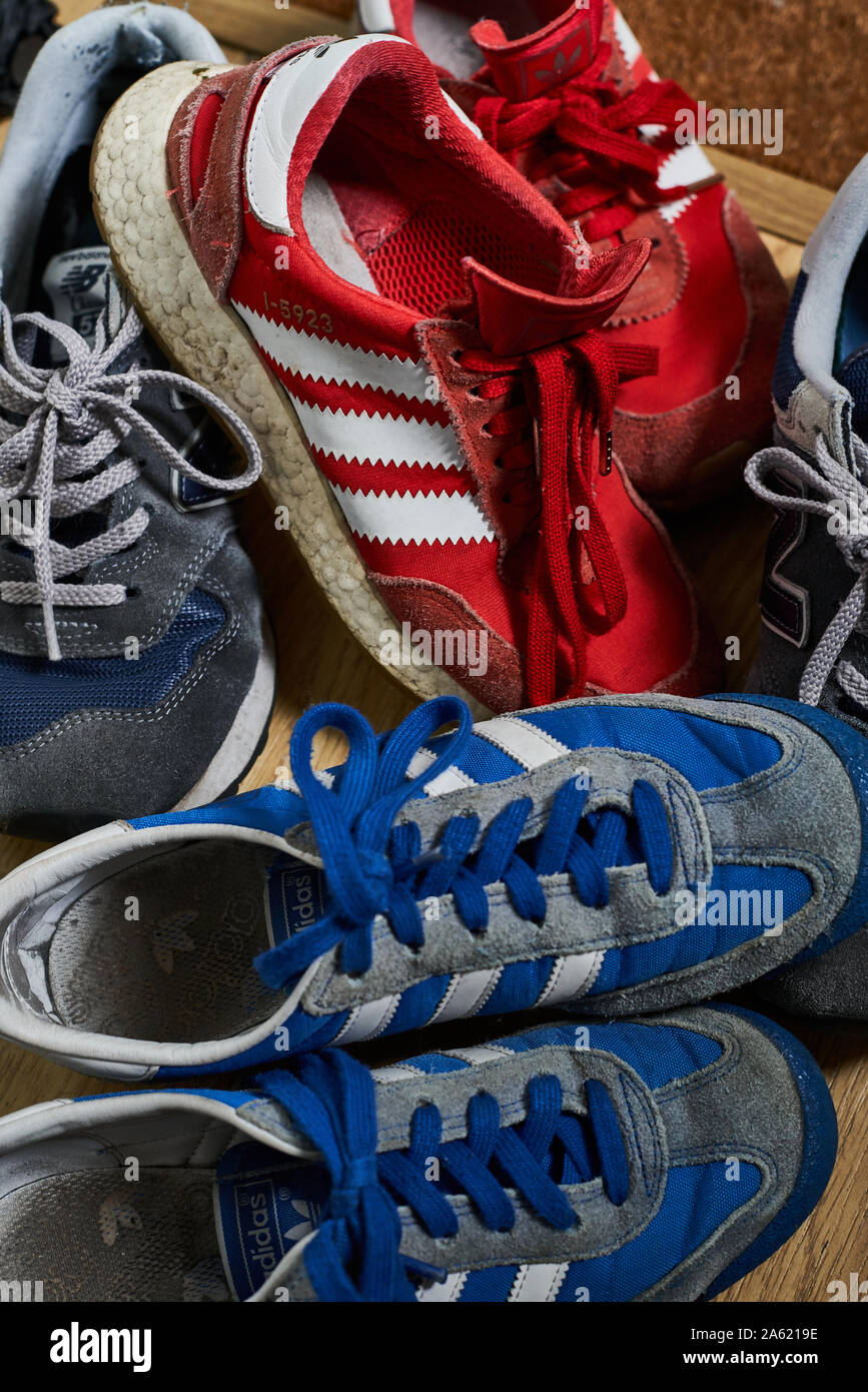 Collection of trainers in a home hallway. Stock Photo