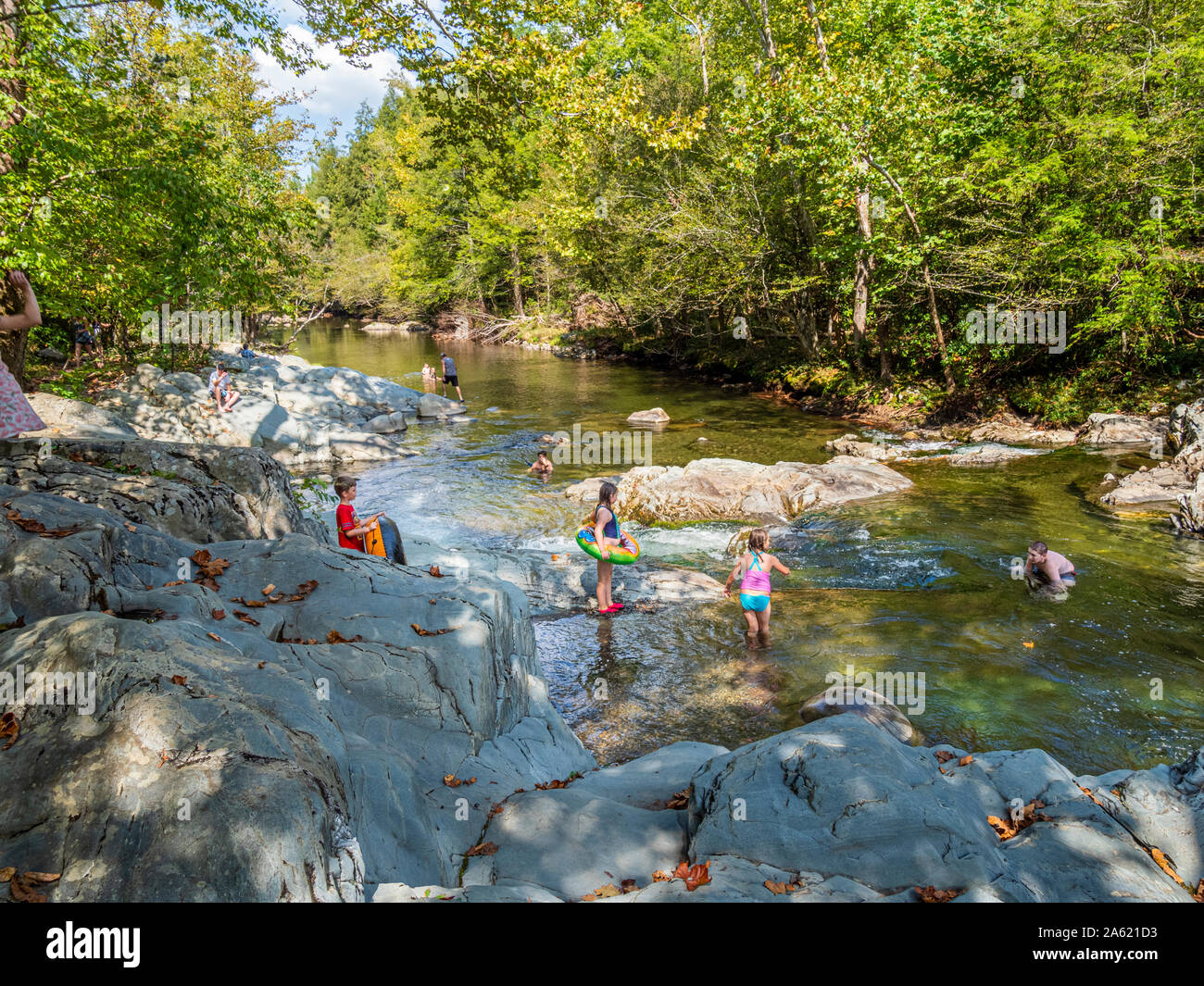 People in the Little Pigeon River in the Greenbrier area of  Great Smoky Mountains National Park in Tennessee in the United States Stock Photo
