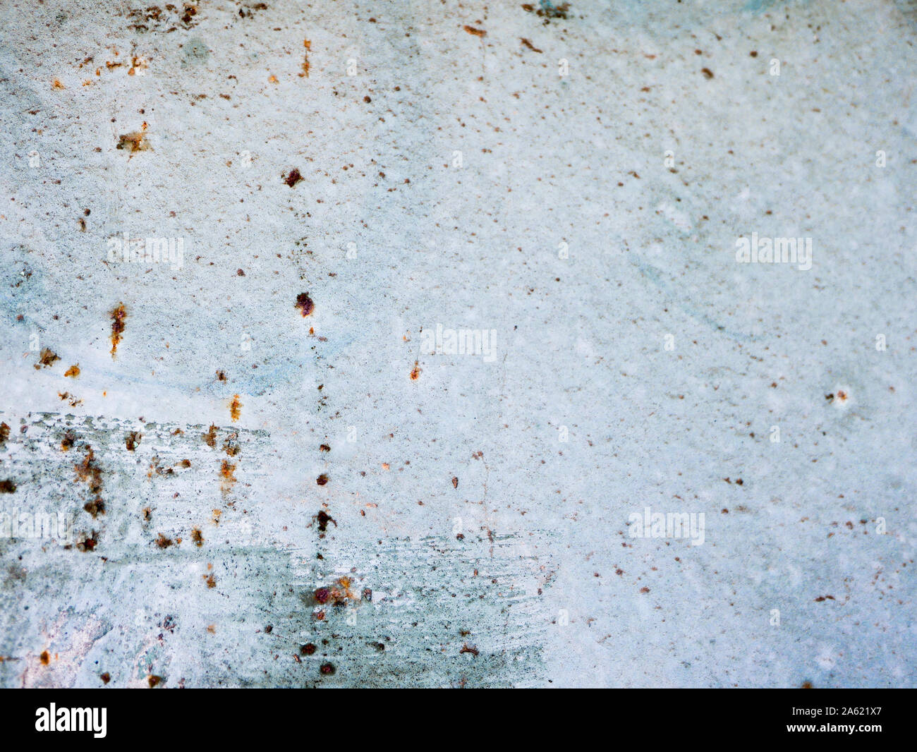 rust points on a blue background. blue wall texture deteriorated with rust points. Texture of painted grey metal with corrosion points.  Stock Photo