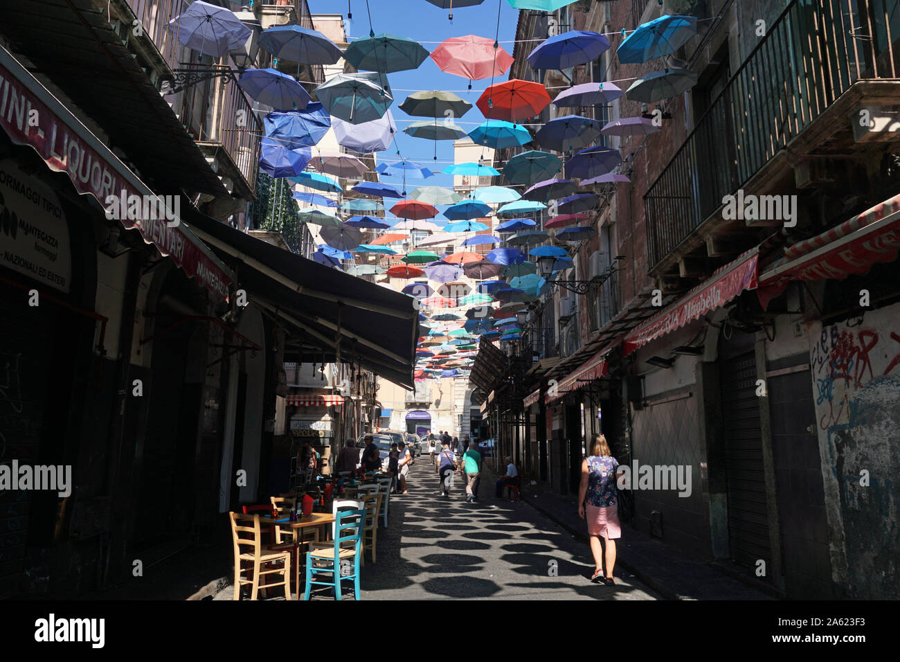The colorful umbrellas of the Umbrella Sky Project in Via Gisira and Via Pardo, Catania, Sicly, Italy, Stock Photo