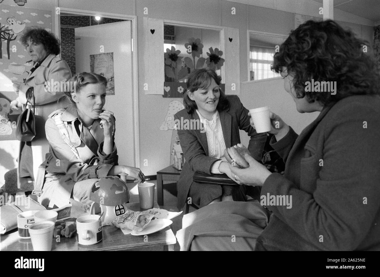 Catholic families from Derry Londonderry allowed a weekly visit to relatives imprisoned in the Crumlin Road prison jail Belfast 1983.The Troubles 1980s. Tea and playgroup for children after visiting men in jail. HOMER SYKES. Stock Photo