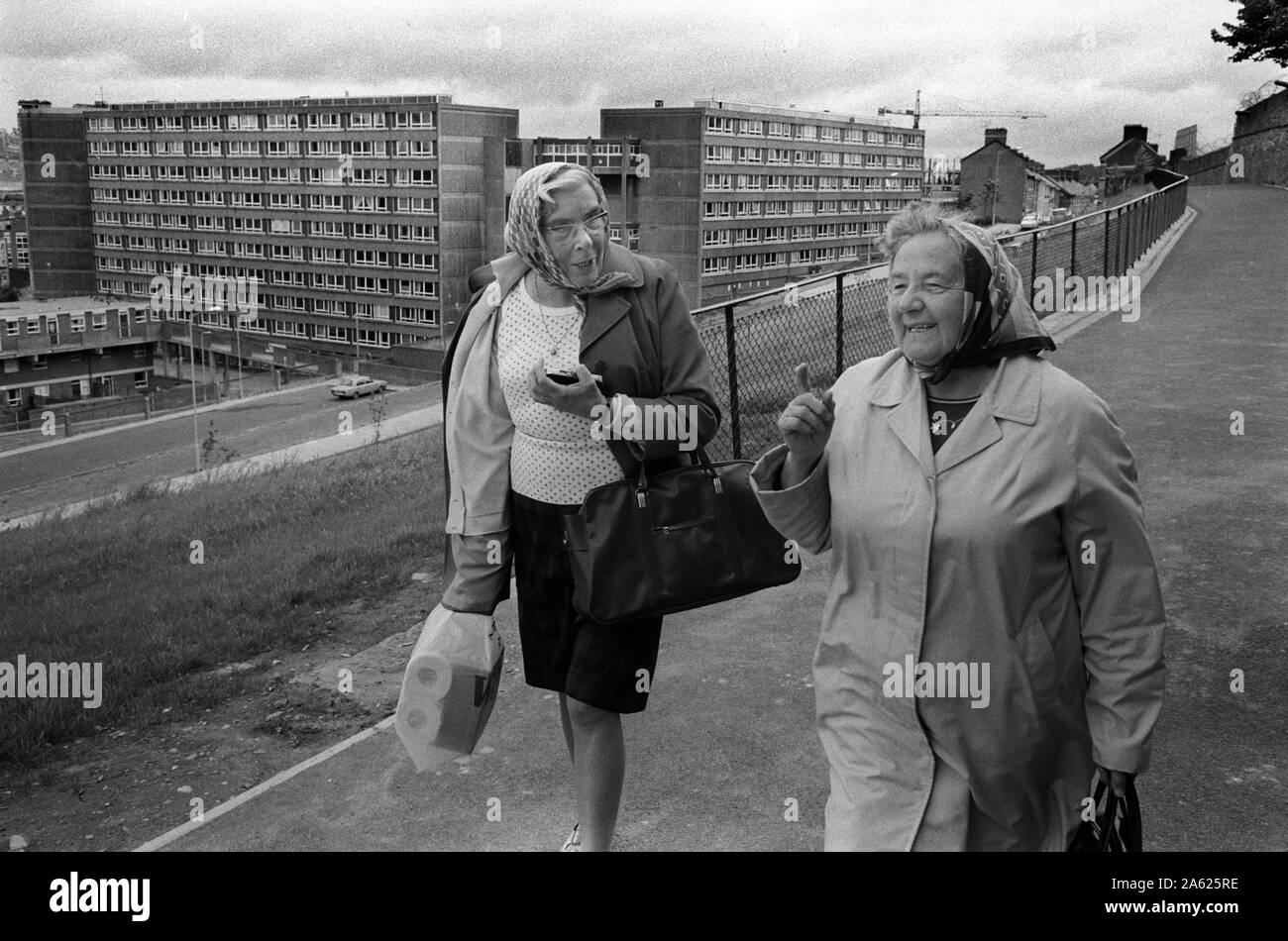 Bogside Derry Northern Ireland Londonderry. 1970s.Two Protestant women look down to where their homes in Catholic Derry used to be. They have been moved out due to sectarian violence. The Troubles 70s 1979 UK HOMER SYKES Stock Photo