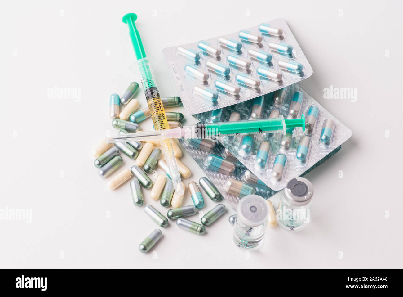 Spilled tablets, capsules, medicaments and syringes with needles and