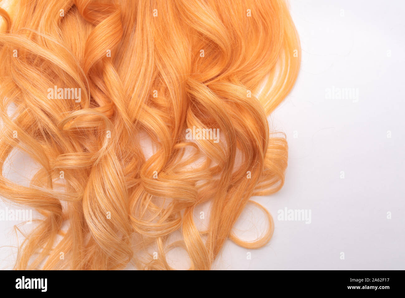 Human, natural honey-colored blond hair on white isolated background.  Stylish, fashionable colors this year. Honey blonde shaken, wave and  undulating Stock Photo - Alamy