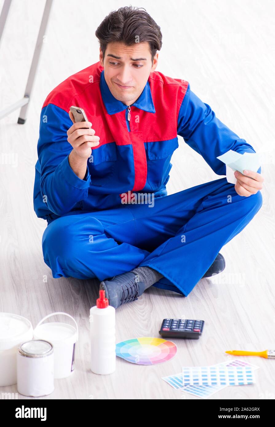 The young painter trying to match colours for painting job Stock Photo Alamy