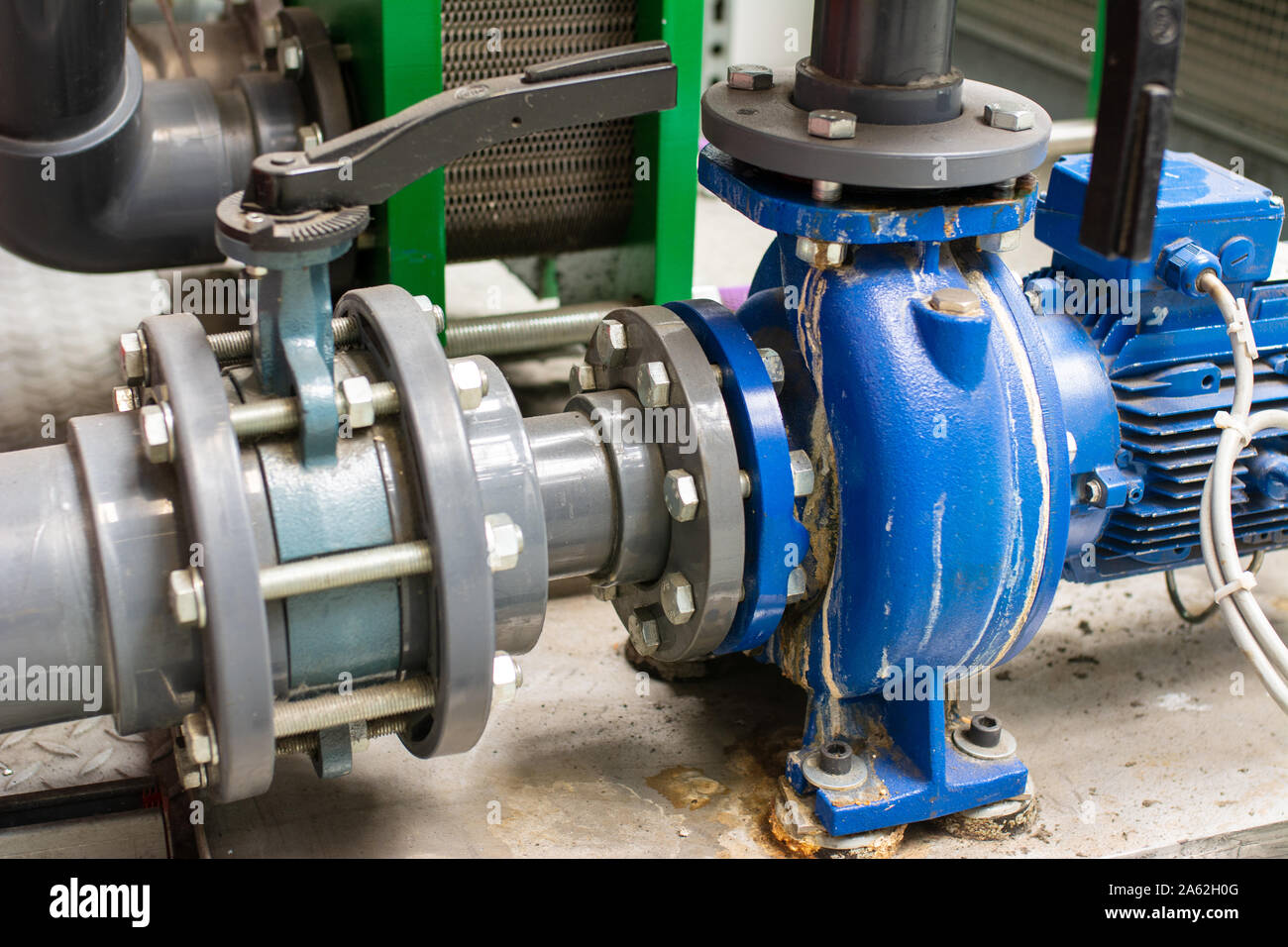 Leaking on the pump. Connection of pipes with pump and motor. Open ball