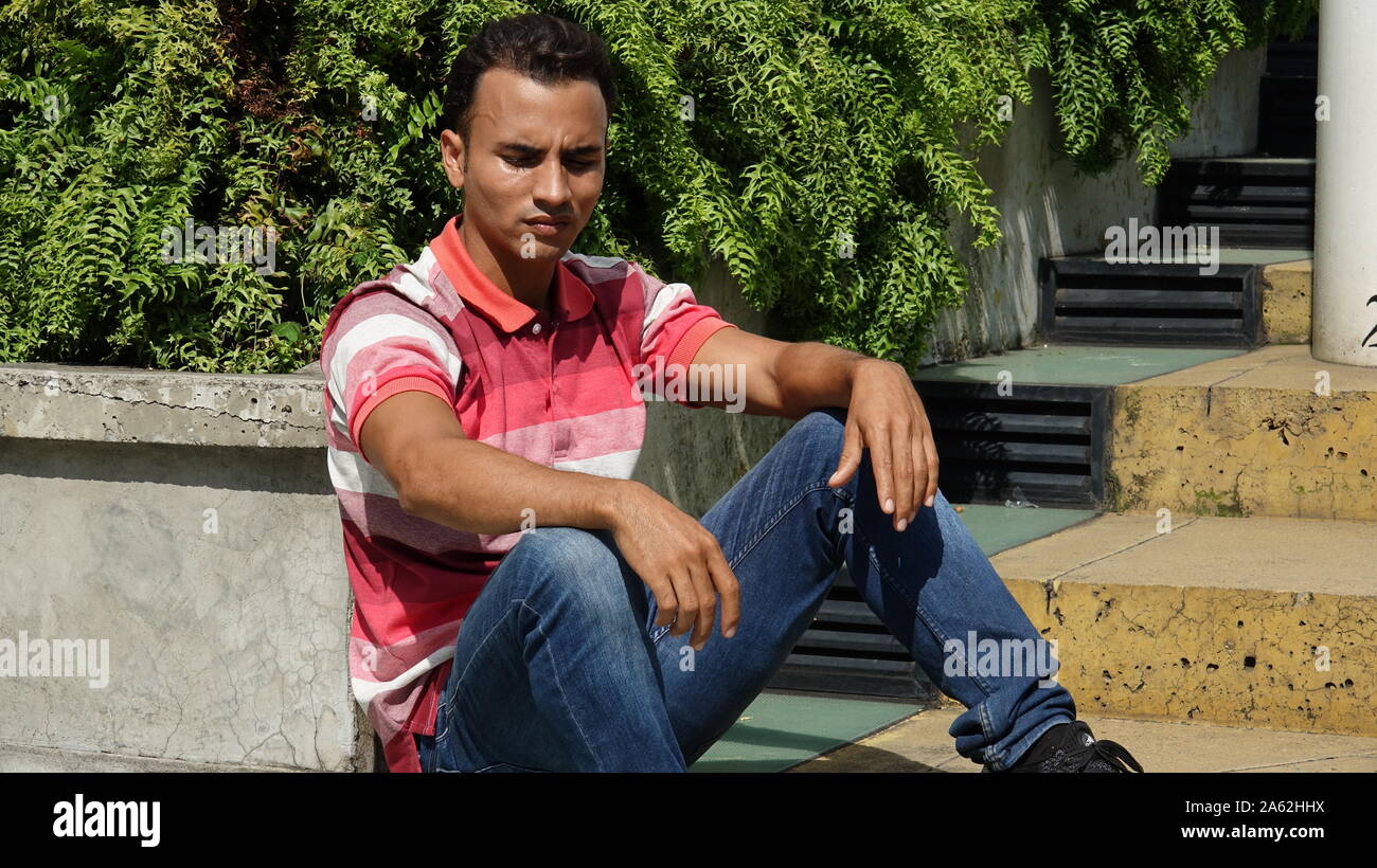 Seated male hispanic hi-res stock photography and images - Alamy