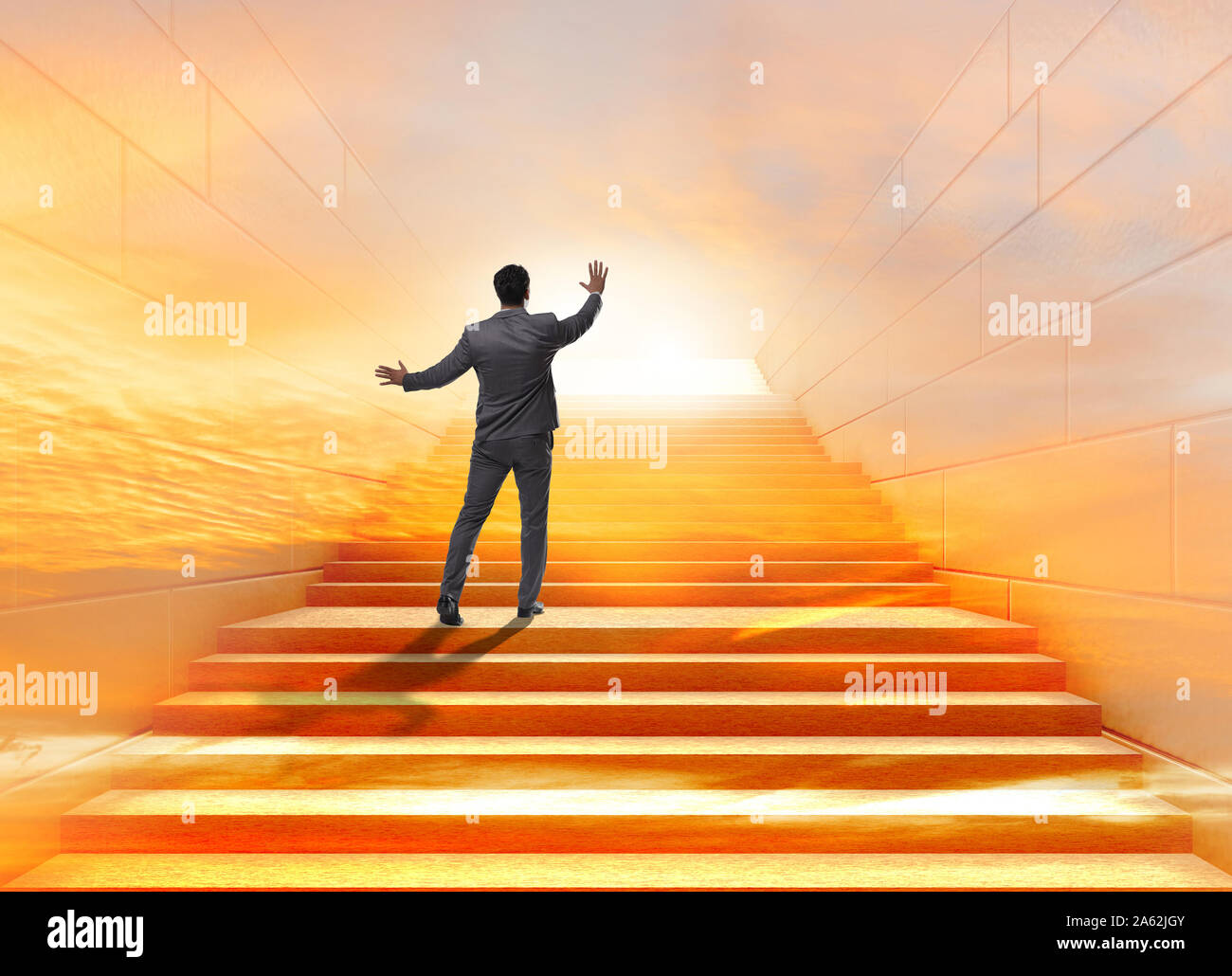 Businessman climbing up challenging career ladder in business concept ...