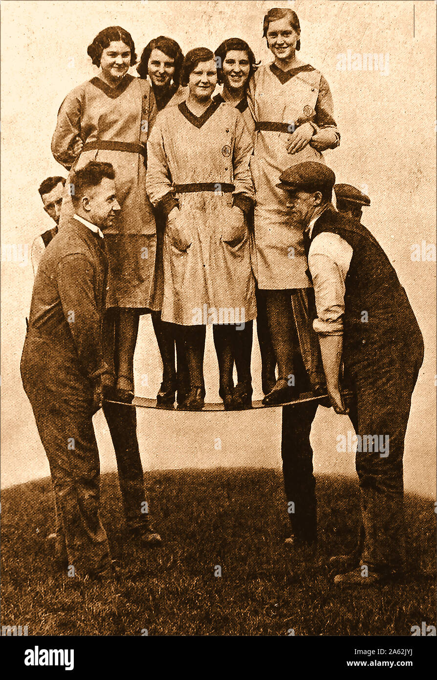 An Early photograph of  British Armour Plate Glass workers (believed to be from Pilkington Brothers Ltd manufacturers)  demonstrating the strength of their product. Similar products included  Armourclad (Spandrel) , Armourfloat, Armourlight  (heat strengthened) and decorative Armourscreen. Stock Photo