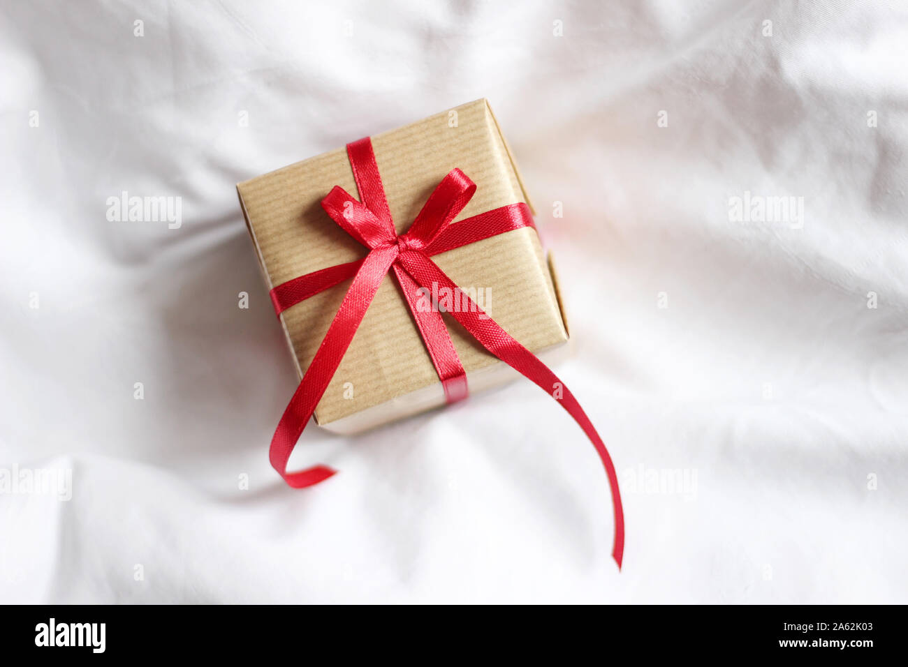 Closeup of Stylish Decorated Gift Box. Holidays Gifts. Christmas  Present Box Isolated on White Bed Background Stock Photo