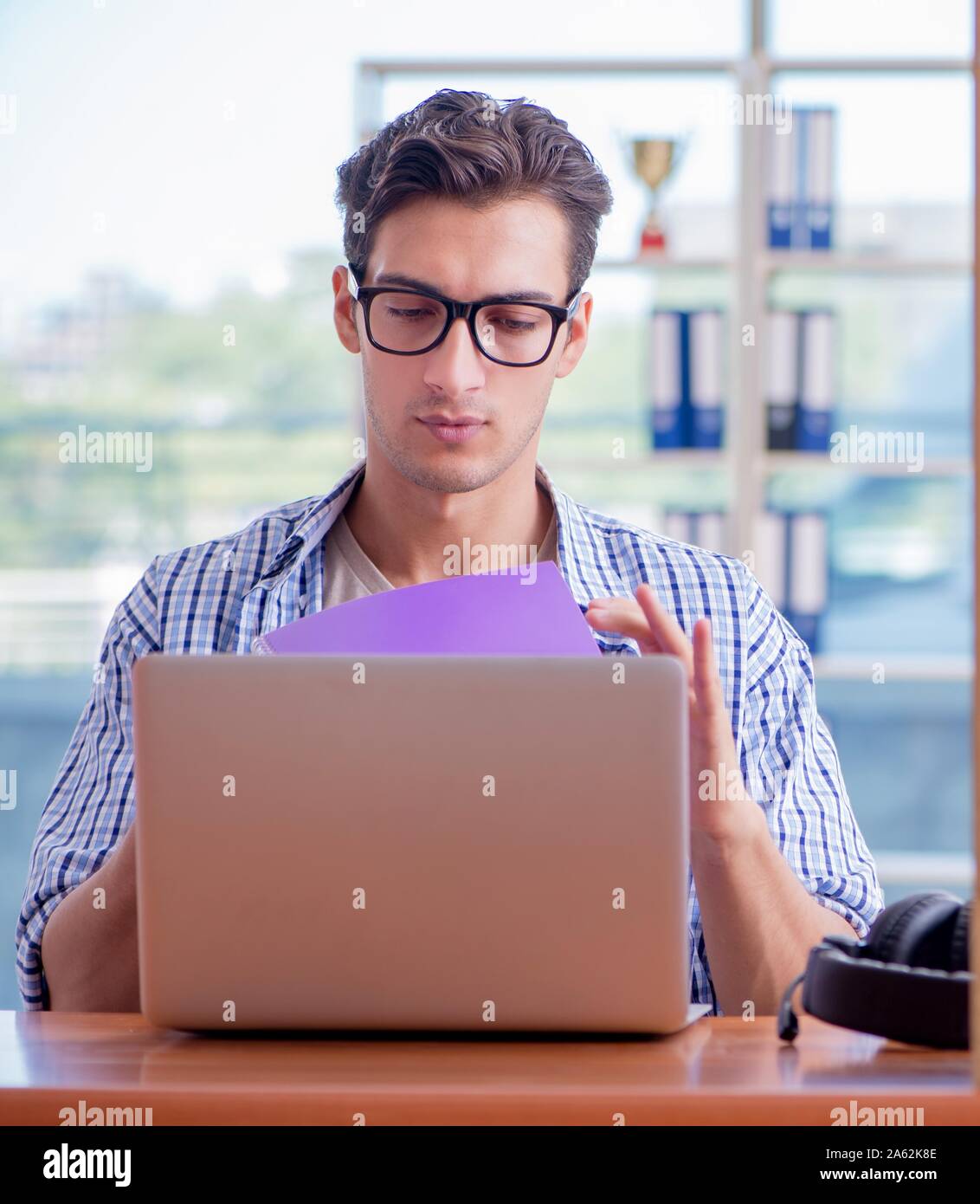 The student studying at home preparing for exam Stock Photo - Alamy