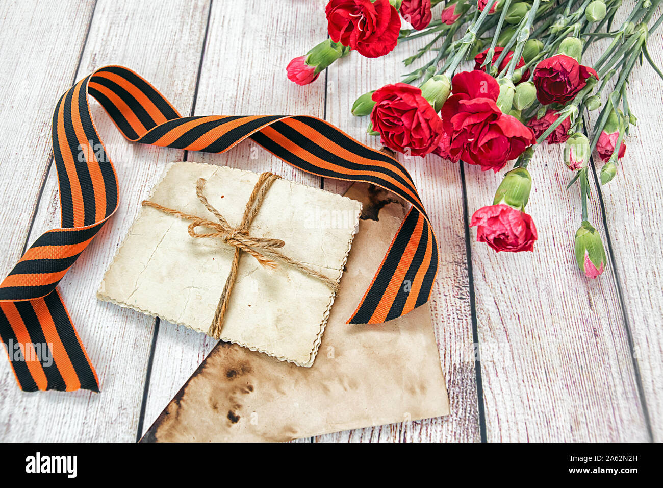 Victory Day. May 9. Carnations, old photos and St. George ribbon Stock ...